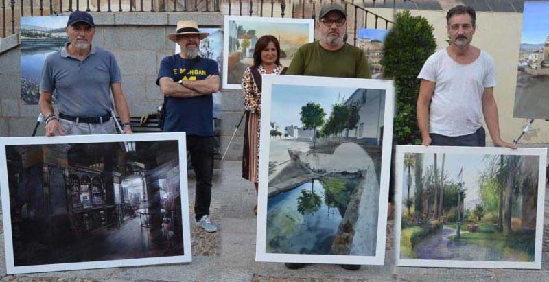 Los tres premiados con sus obras