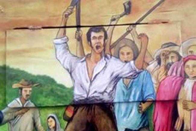 tapas-de-contadores-pintadas-al-aire-libre-por-artistas-en-charala-santander-de-colombia-